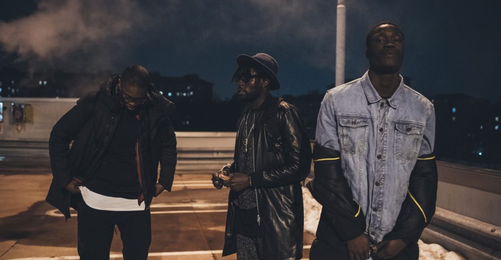 three young men posing outdoor looking camera serious - rap crew, gang, swag concept